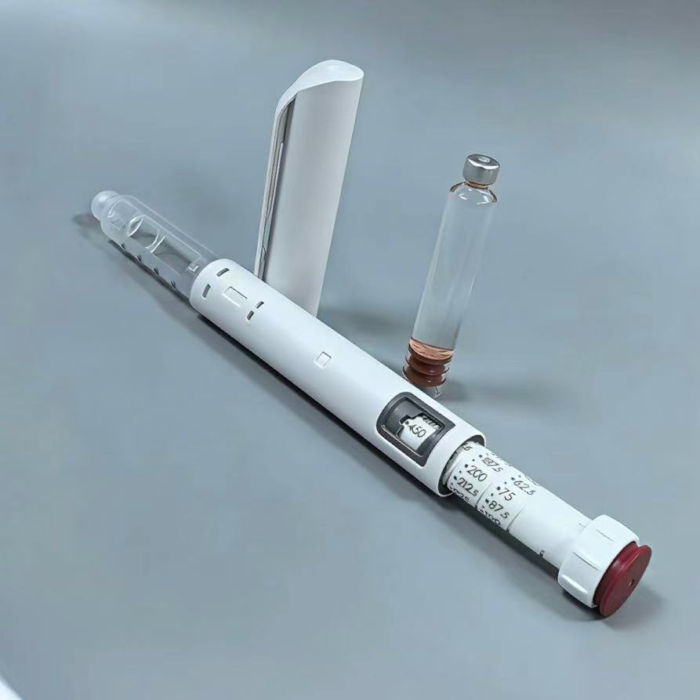 Close up of medical pen injector plunger extended during accurate dose setting