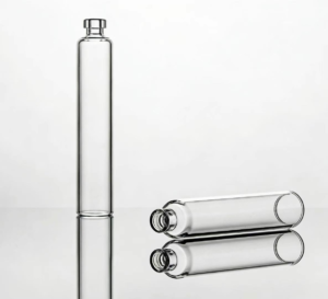 Transparent cylindrical glass cartridges for pharmaceutical packaging showing reflective surface