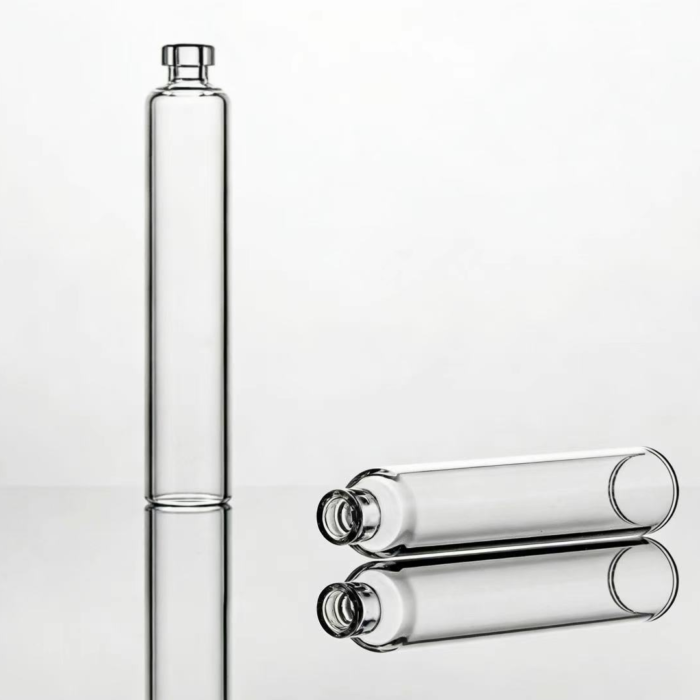 Transparent cylindrical glass cartridges for pharmaceutical packaging showing reflective surface