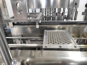 Multi-head stainless steel nozzles for high speed auto injector filling.